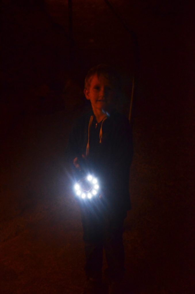 To show how dark the caves where and how big the flash light was. The picture is dark, you only see Yuri in the middle, because he's holding a big flash light. Gorges du Verdon with kids.