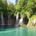 Plitvice Falls, small streams dropping down in a clear greenish lake